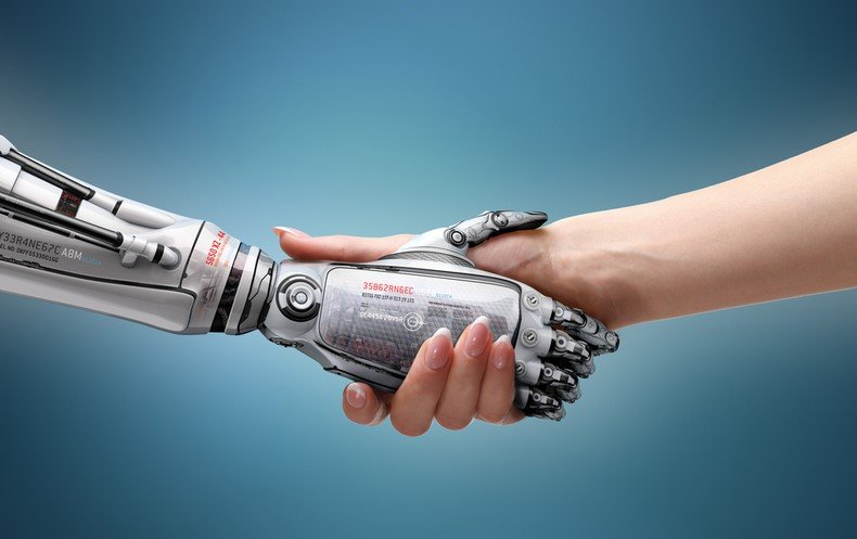 Female,Human,And,Robot's,Handshake,As,A,Symbol,Of,Connection