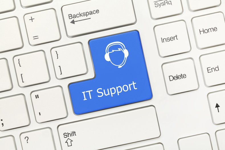 Close-up view on white conceptual keyboard - IT Support (blue key)