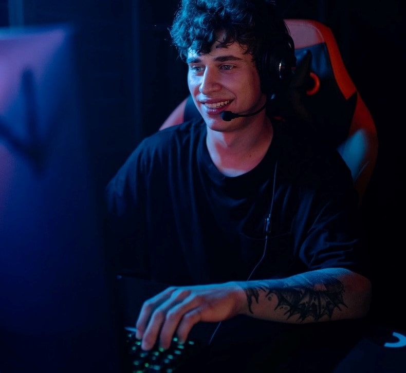 A person playing soccer on gaming laptop